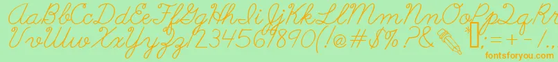 AbcCursive Font – Orange Fonts on Green Background