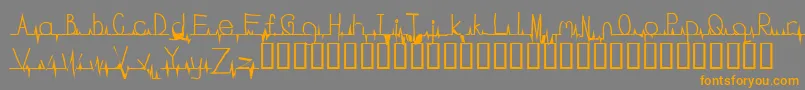 フォントFlatline – オレンジの文字は灰色の背景にあります。