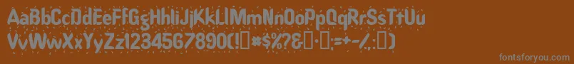 フォントRaindancessk – 茶色の背景に灰色の文字