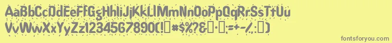 Raindancessk-Schriftart – Graue Schriften auf gelbem Hintergrund