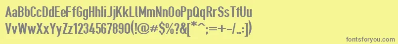 フォントGiveahootbd – 黄色の背景に灰色の文字