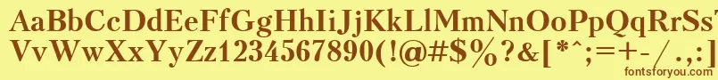 フォントUkrainiankudriashovBold – 茶色の文字が黄色の背景にあります。