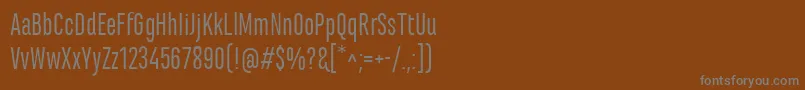 MarianinaCnFyRegular-fontti – harmaat kirjasimet ruskealla taustalla