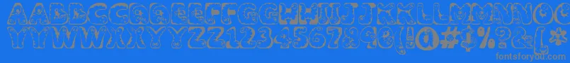 フォントWiggles1 – 青い背景に灰色の文字
