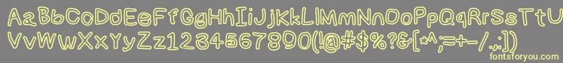 Numbbunnybkout-Schriftart – Gelbe Schriften auf grauem Hintergrund