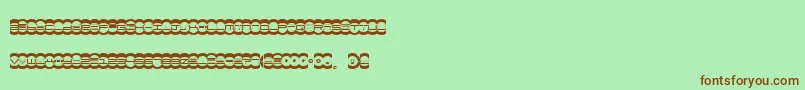 Czcionka Miste – brązowe czcionki na zielonym tle