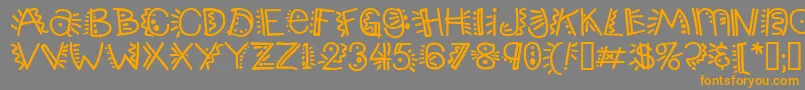フォントPopticsthree – オレンジの文字は灰色の背景にあります。