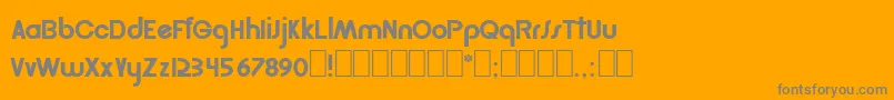 Golder-fontti – harmaat kirjasimet oranssilla taustalla