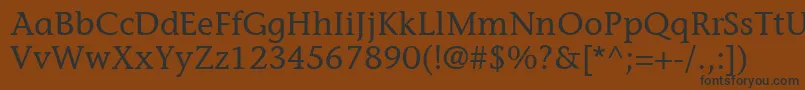 フォントItcStoneInformalLt – 黒い文字が茶色の背景にあります