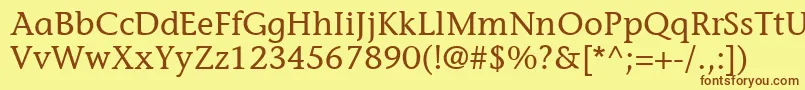 フォントItcStoneInformalLt – 茶色の文字が黄色の背景にあります。