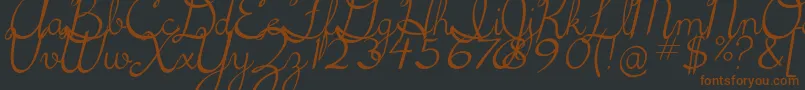 フォント5thgradecursive2Italic – 黒い背景に茶色のフォント