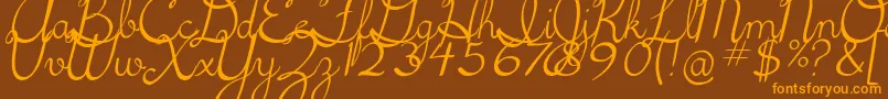 5thgradecursive2Italic-fontti – oranssit fontit ruskealla taustalla