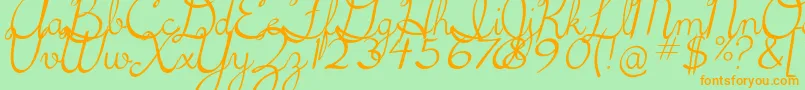 フォント5thgradecursive2Italic – オレンジの文字が緑の背景にあります。