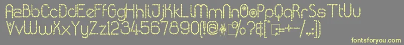 KingthingsPoppalok-Schriftart – Gelbe Schriften auf grauem Hintergrund