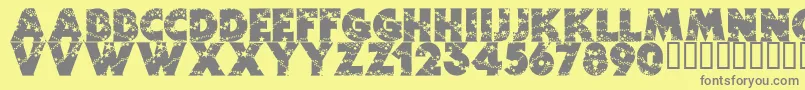 Wizardry-fontti – harmaat kirjasimet keltaisella taustalla