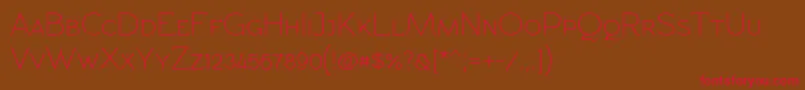 フォントRawengulkpcs – 赤い文字が茶色の背景にあります。