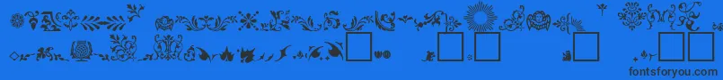Czcionka FleuronsA – czarne czcionki na niebieskim tle
