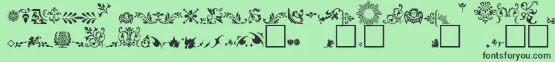 Czcionka FleuronsA – czarne czcionki na zielonym tle