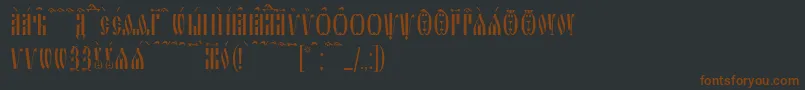 フォントSlavjanicKucs – 黒い背景に茶色のフォント