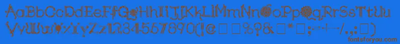 Fonte KingthingsNeedles – fontes marrons em um fundo azul