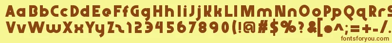 フォントAbraxeous – 茶色の文字が黄色の背景にあります。