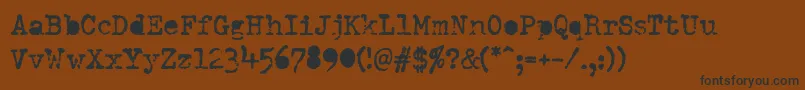 DumboldtypewriterAlternatebold Font – Black Fonts on Brown Background