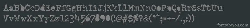 フォントDumboldtypewriterAlternatebold – 黒い背景に灰色の文字