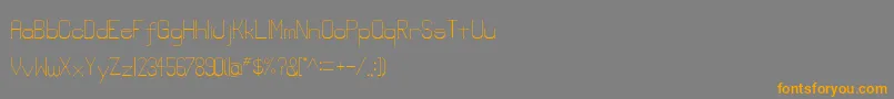 フォントLowerlay – オレンジの文字は灰色の背景にあります。