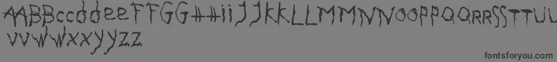 フォントGothikaIssueA – 黒い文字の灰色の背景
