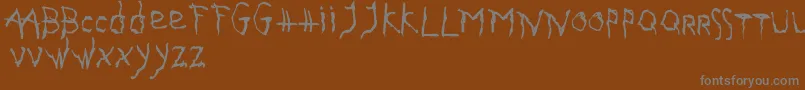 GothikaIssueA Font – Gray Fonts on Brown Background