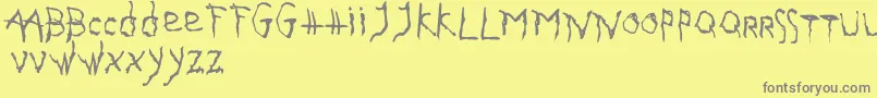 GothikaIssueA Font – Gray Fonts on Yellow Background