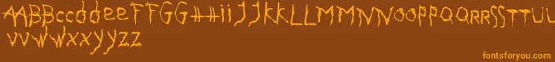 GothikaIssueA Font – Orange Fonts on Brown Background