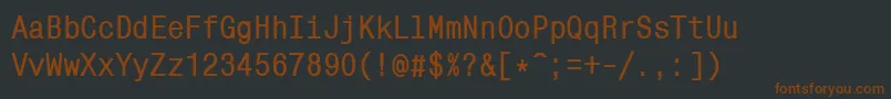 Fonte MonocondensedcttBold – fontes marrons em um fundo preto