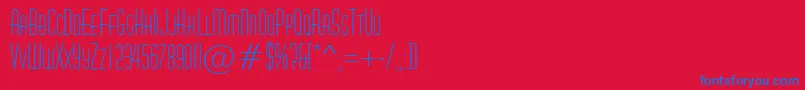 AHuxleycaps-Schriftart – Blaue Schriften auf rotem Hintergrund