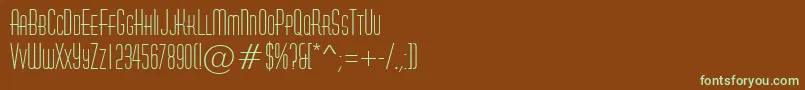 フォントAHuxleycaps – 緑色の文字が茶色の背景にあります。