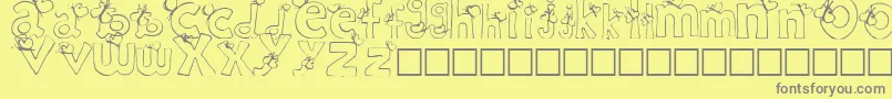 フォントRypChildc – 黄色の背景に灰色の文字