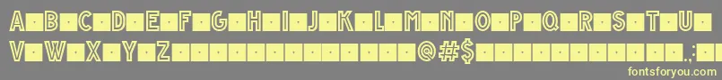 GrandeAndrettiRegularV1.0LimitedCharset Font – Yellow Fonts on Gray Background