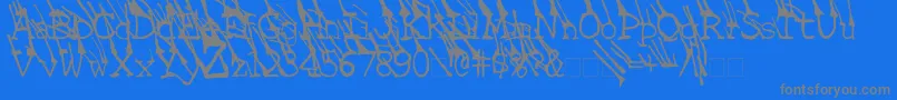LinotypeGrassyBold-fontti – harmaat kirjasimet sinisellä taustalla