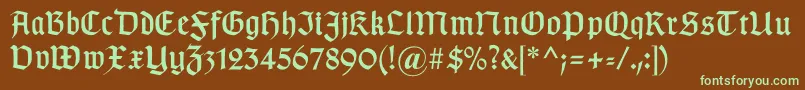 フォントGotischa – 緑色の文字が茶色の背景にあります。