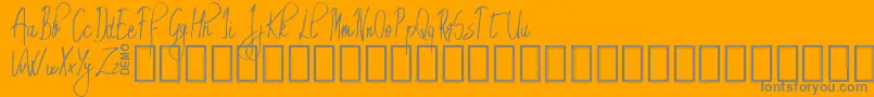 EmrytDemo-fontti – harmaat kirjasimet oranssilla taustalla