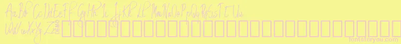 EmrytDemo-Schriftart – Rosa Schriften auf gelbem Hintergrund