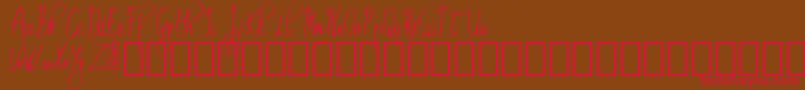 フォントEmrytDemo – 赤い文字が茶色の背景にあります。