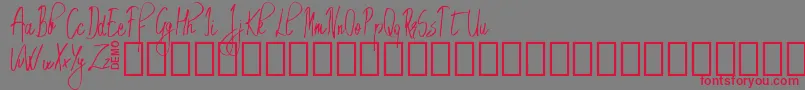フォントEmrytDemo – 赤い文字の灰色の背景