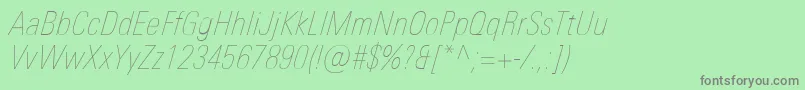 Шрифт UniversNextProUltralightCondensedItalic – серые шрифты на зелёном фоне