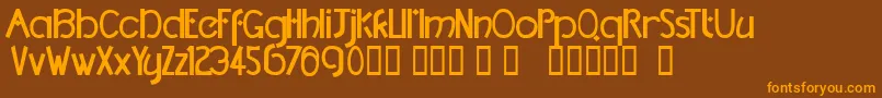 フォントTmDccNormal – オレンジ色の文字が茶色の背景にあります。