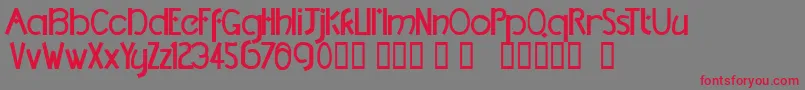 フォントTmDccNormal – 赤い文字の灰色の背景