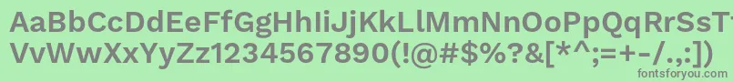 WorksansSemibold-fontti – harmaat kirjasimet vihreällä taustalla