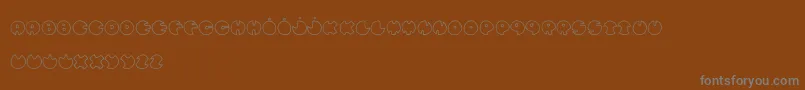 Czcionka BullesDeConfiance – szare czcionki na brązowym tle