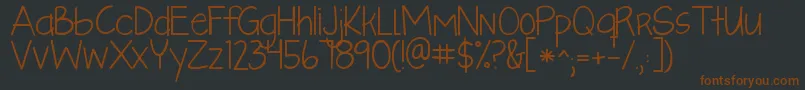 Kglikeaskyscraper Font – Brown Fonts on Black Background
