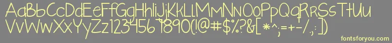 Fonte Kglikeaskyscraper – fontes amarelas em um fundo cinza